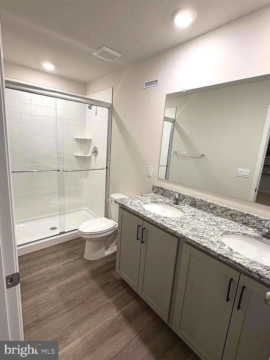 155 Rae Court Luray, VA 22835 - Photo 14 of 23 a bathroom with a granite countertop sink toilet and shower