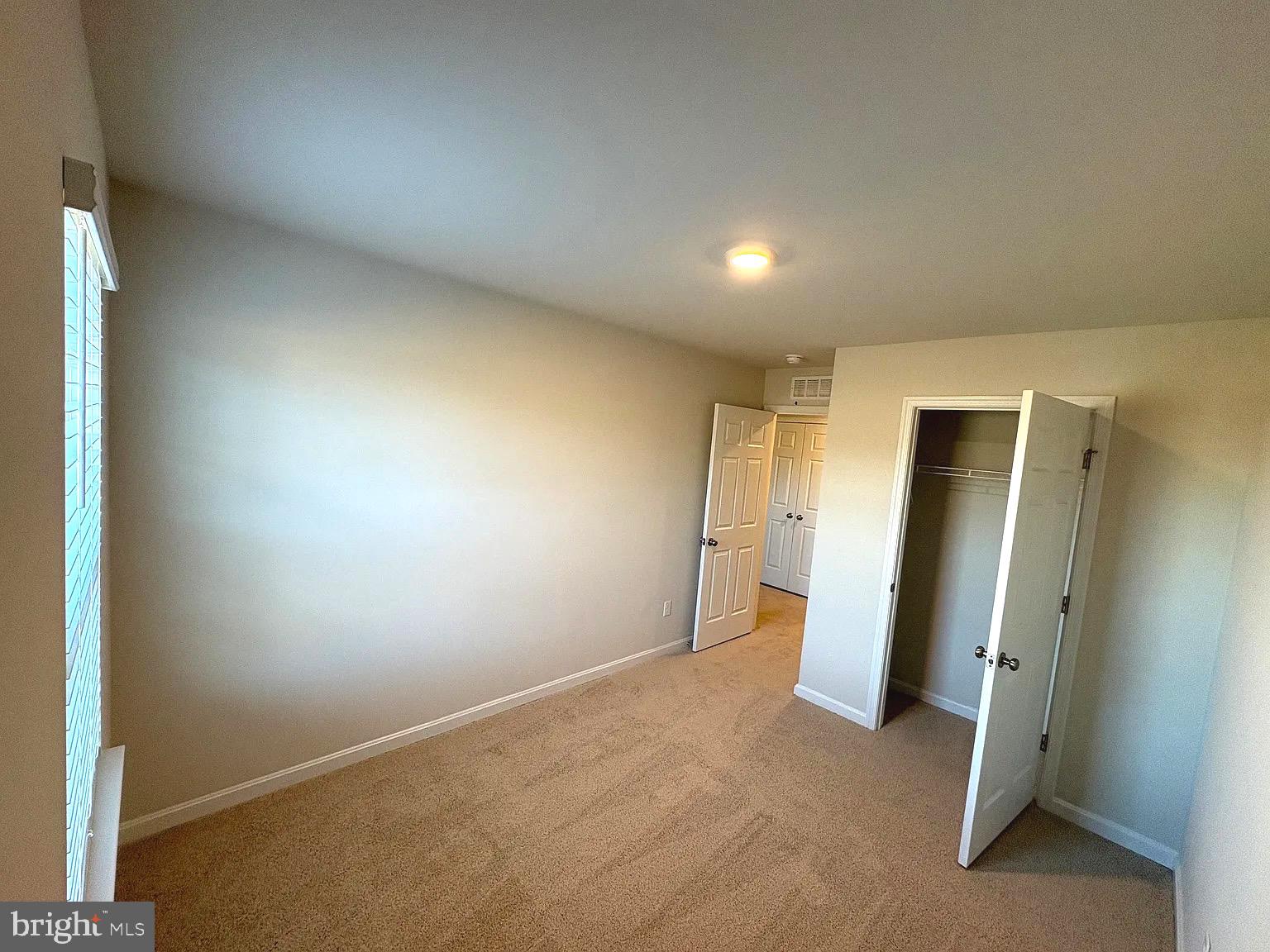 155 Rae Court Luray, VA 22835 - Photo 16 of 23 an empty room with closet and bathroom
