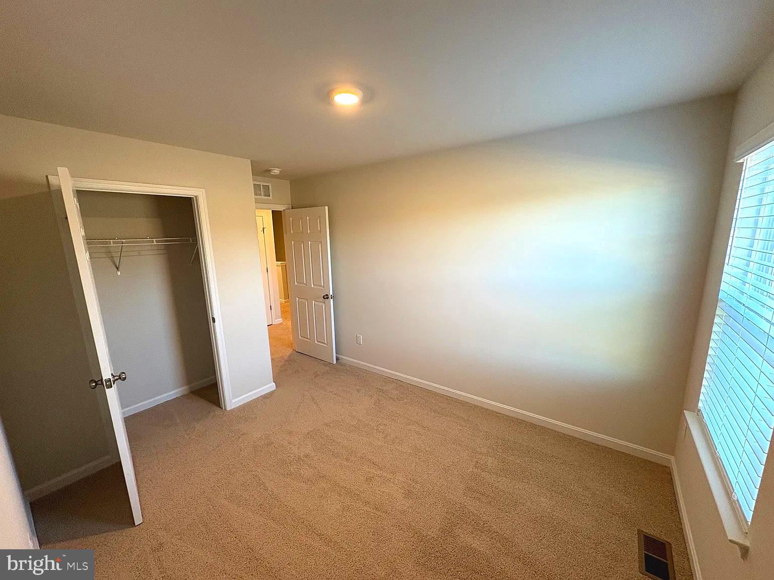 155 Rae Court Luray, VA 22835 - Photo 17 of 23 an empty room with a window and a bathroom