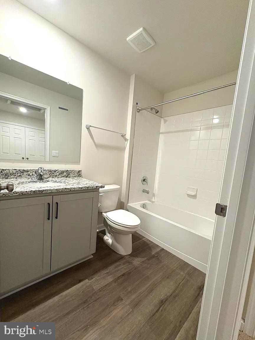 155 Rae Court Luray, VA 22835 - Photo 18 of 23 a bathroom with a granite countertop toilet sink and mirror