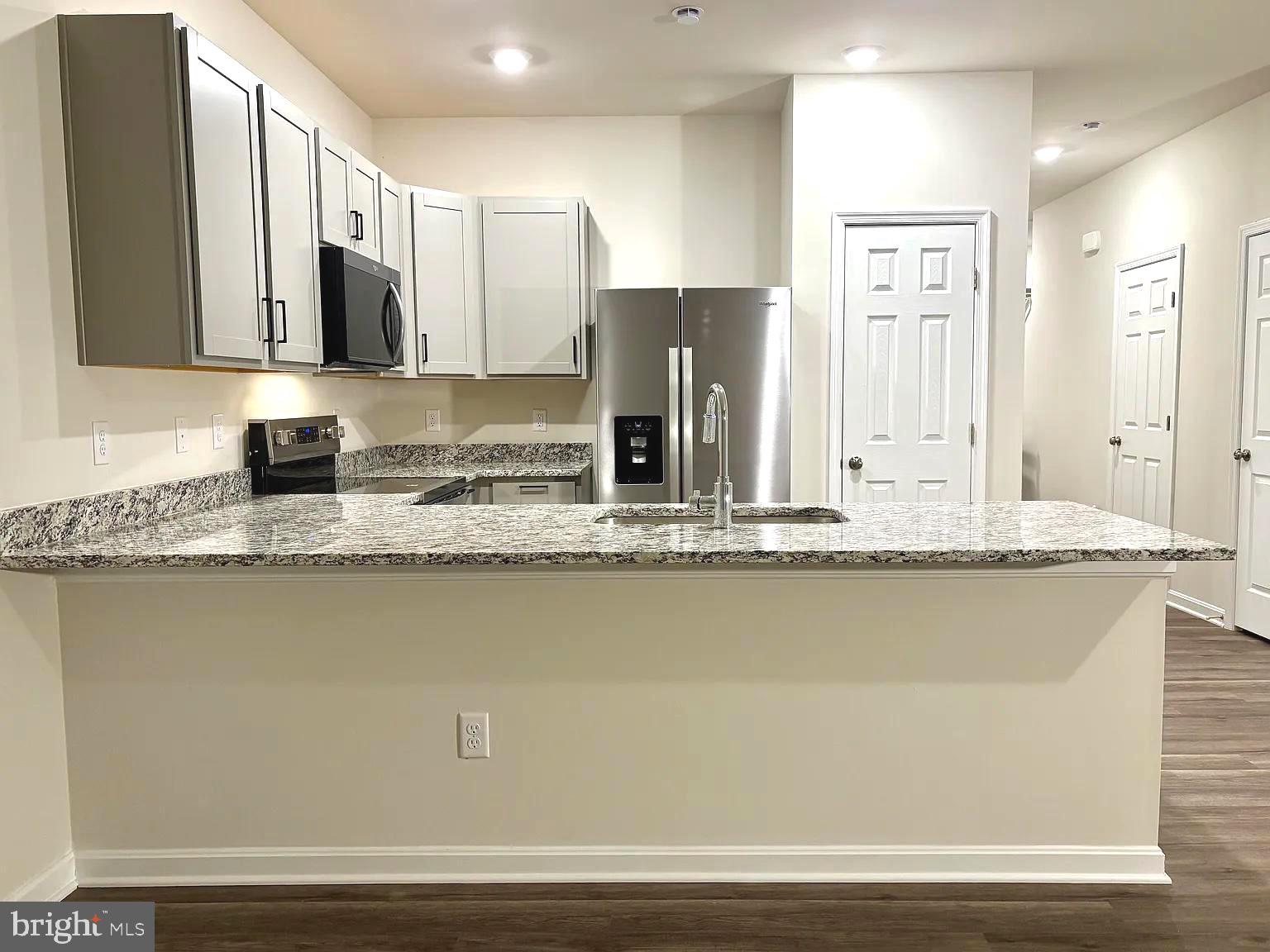 155 Rae Court Luray, VA 22835 - Photo 2 of 23 a kitchen with granite countertop a sink a stove and cabinets