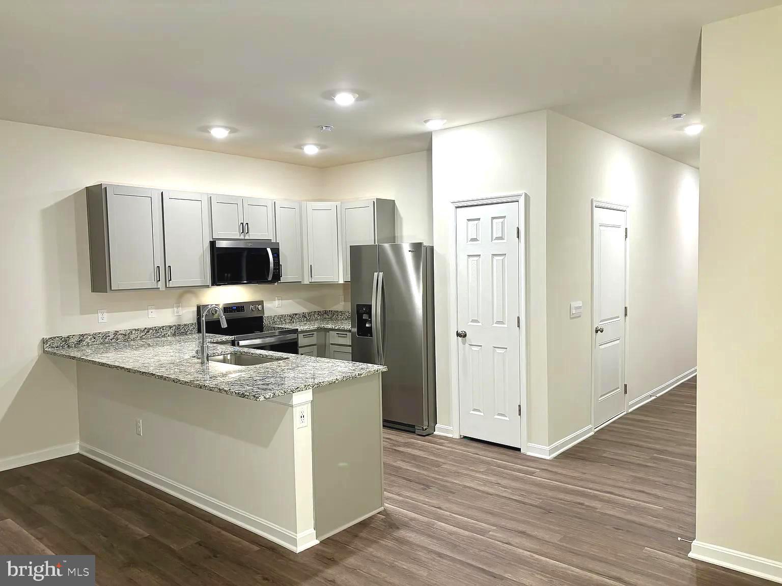 155 Rae Court Luray, VA 22835 - Photo 3 of 23 a kitchen that has a lot of cabinets and wooden floor