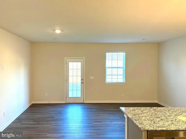 a kitchen with a stove and a sink