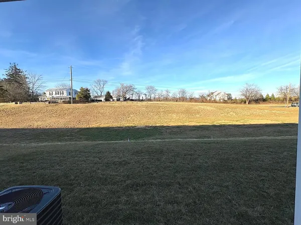 an empty room with wooden floor