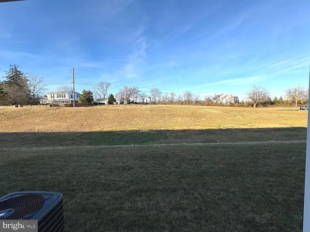 an empty room with wooden floor