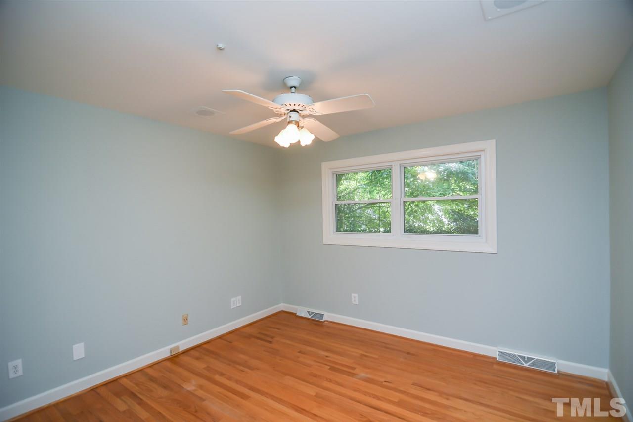 409 May Court Raleigh, NC 27609 - Photo 16 of 25 an empty room with a window and a fan