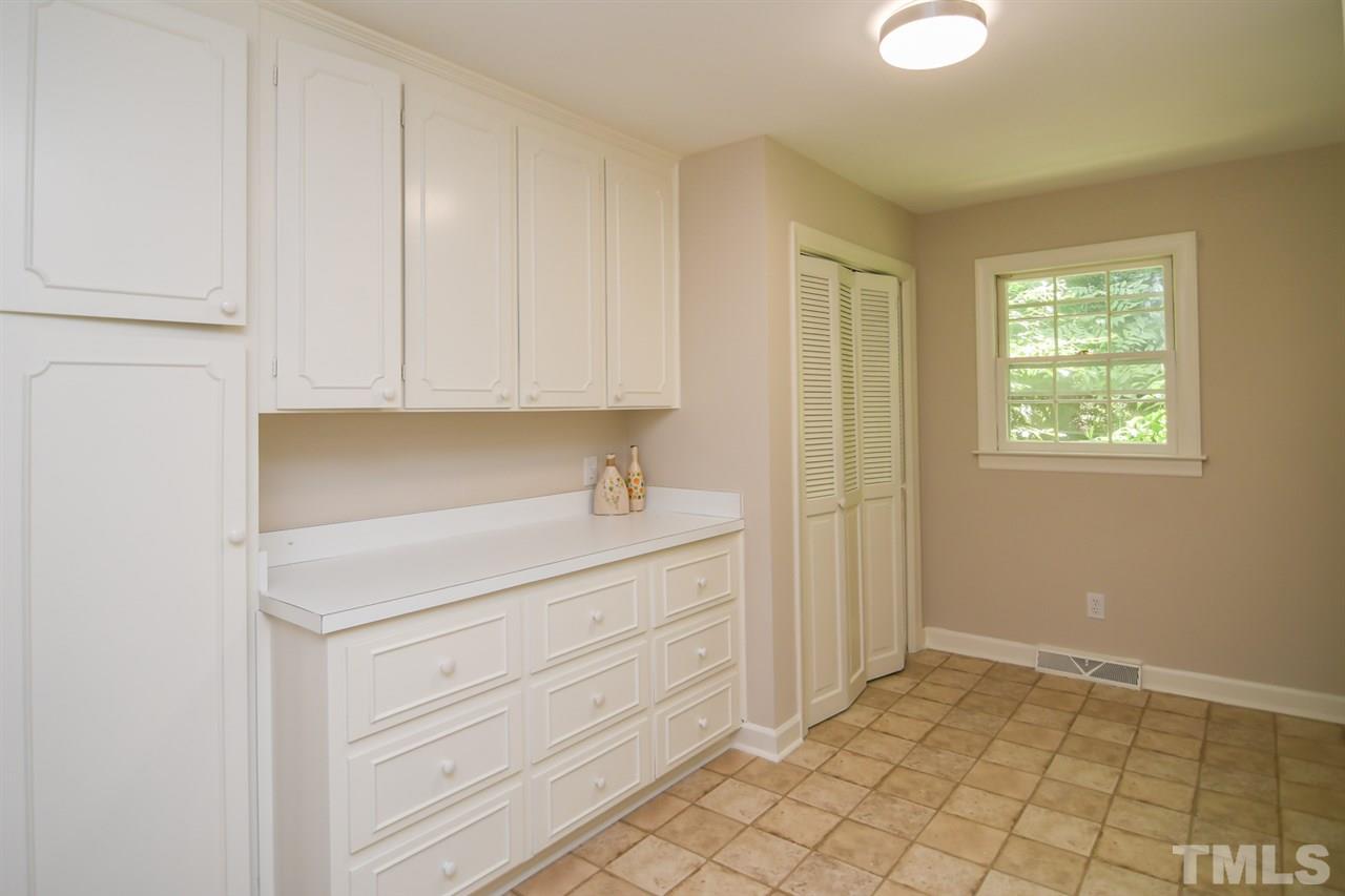 409 May Court Raleigh, NC 27609 - Photo 21 of 25 a room with a sink cabinets and utility room