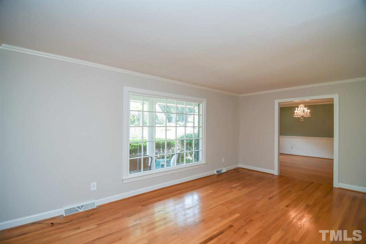 409 May Court Raleigh, NC 27609 - Photo 7 of 25 an empty room with wooden floor and windows