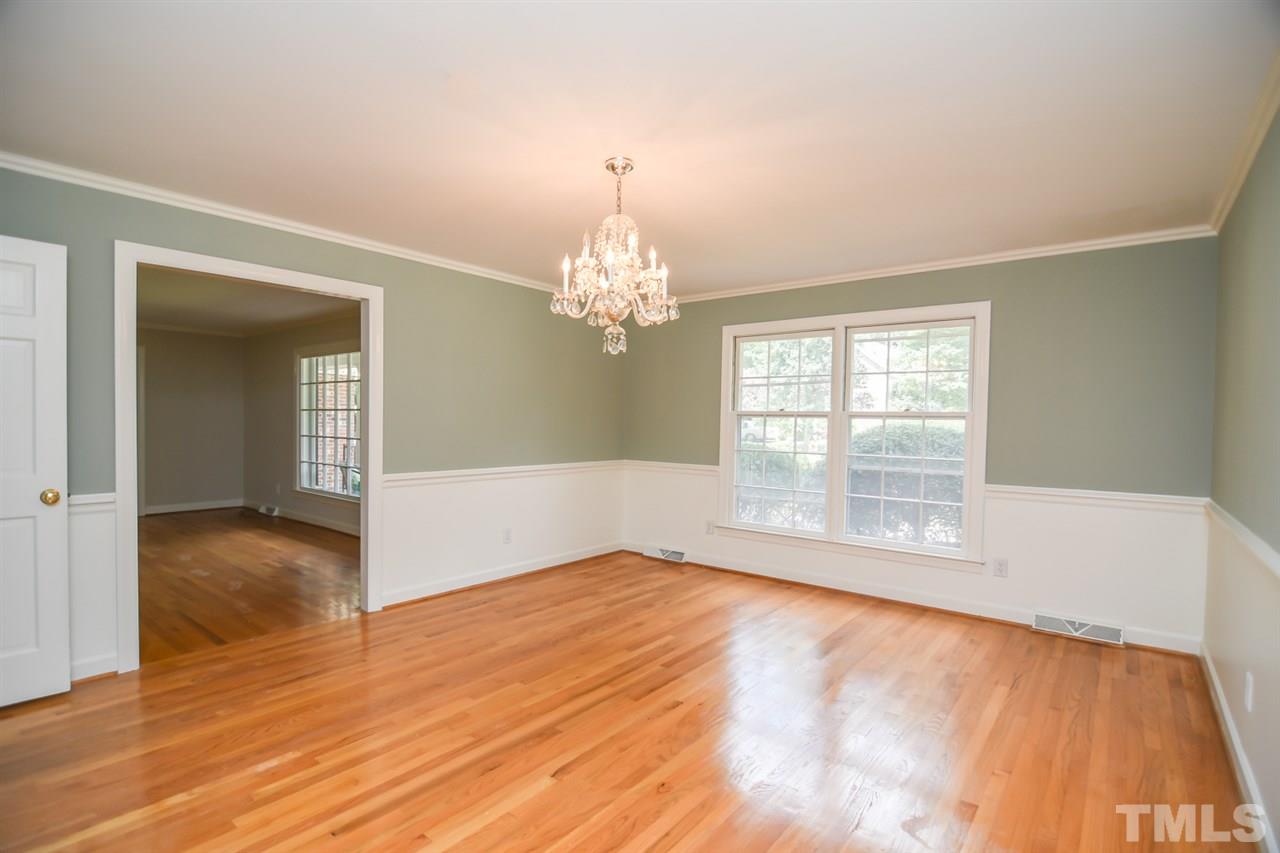 409 May Court Raleigh, NC 27609 - Photo 8 of 25 a view of empty room with wooden floor and fan