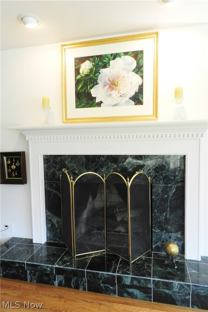Marble accents the fireplace, with its beautifully detailed mantelpiece.