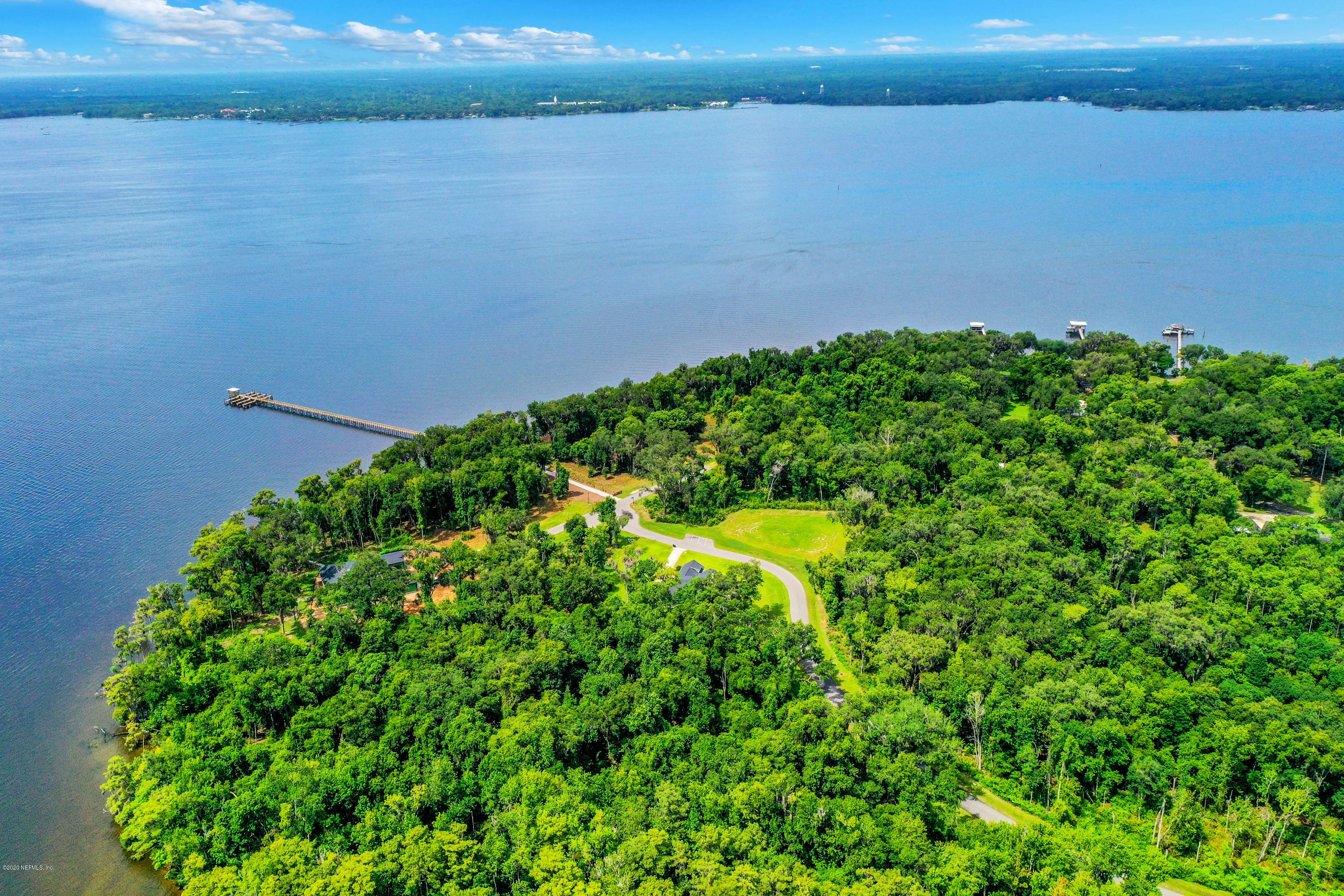 302 Hallowes Cove St. Johns, FL 32259 - Photo 12 of 14 a view of a lake from a yard