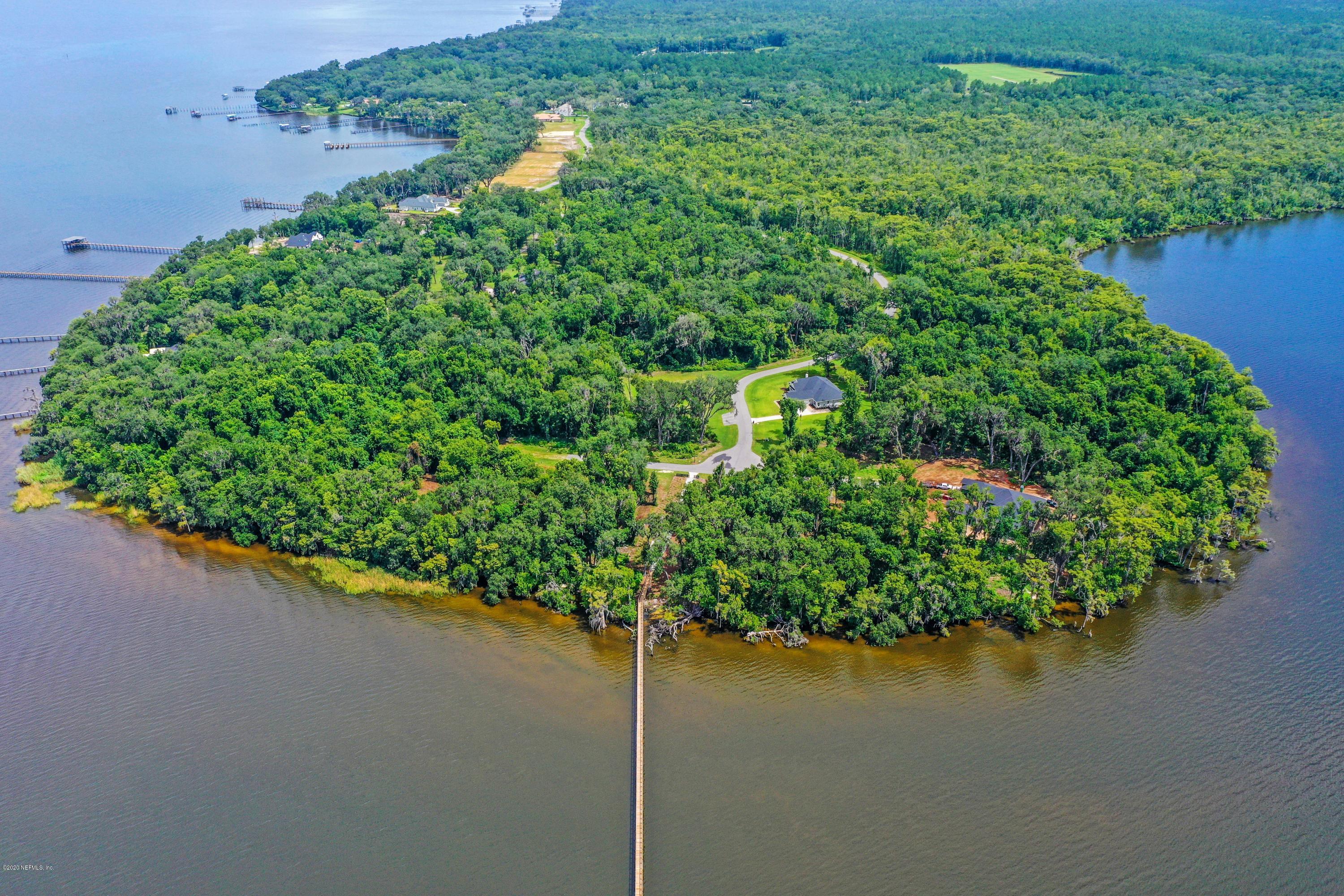 302 Hallowes Cove St. Johns, FL 32259 - Photo 13 of 14 an aerial view of a house with a yard and lake view