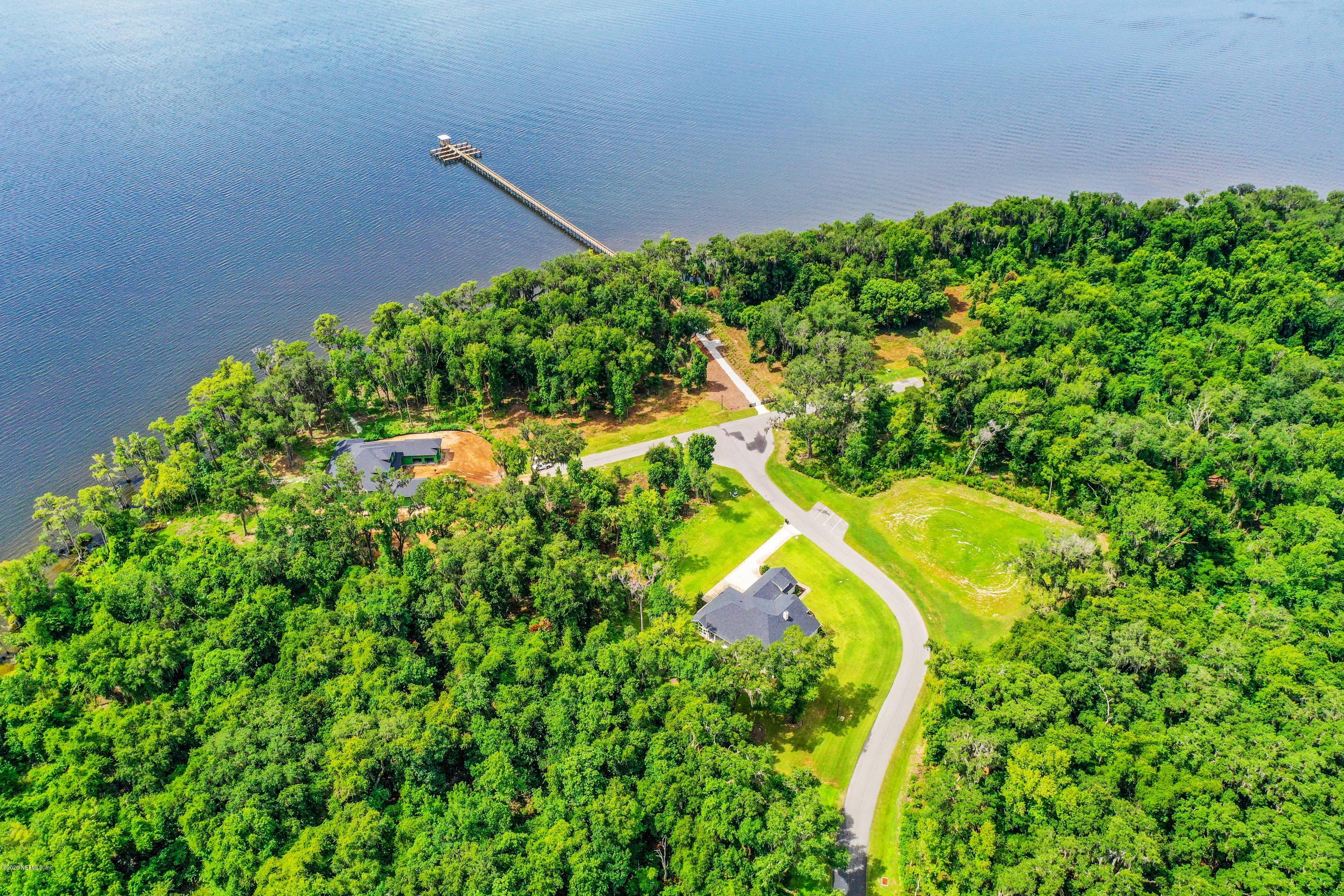 302 Hallowes Cove St. Johns, FL 32259 - Photo 7 of 14 a view of a yard with plants and large trees