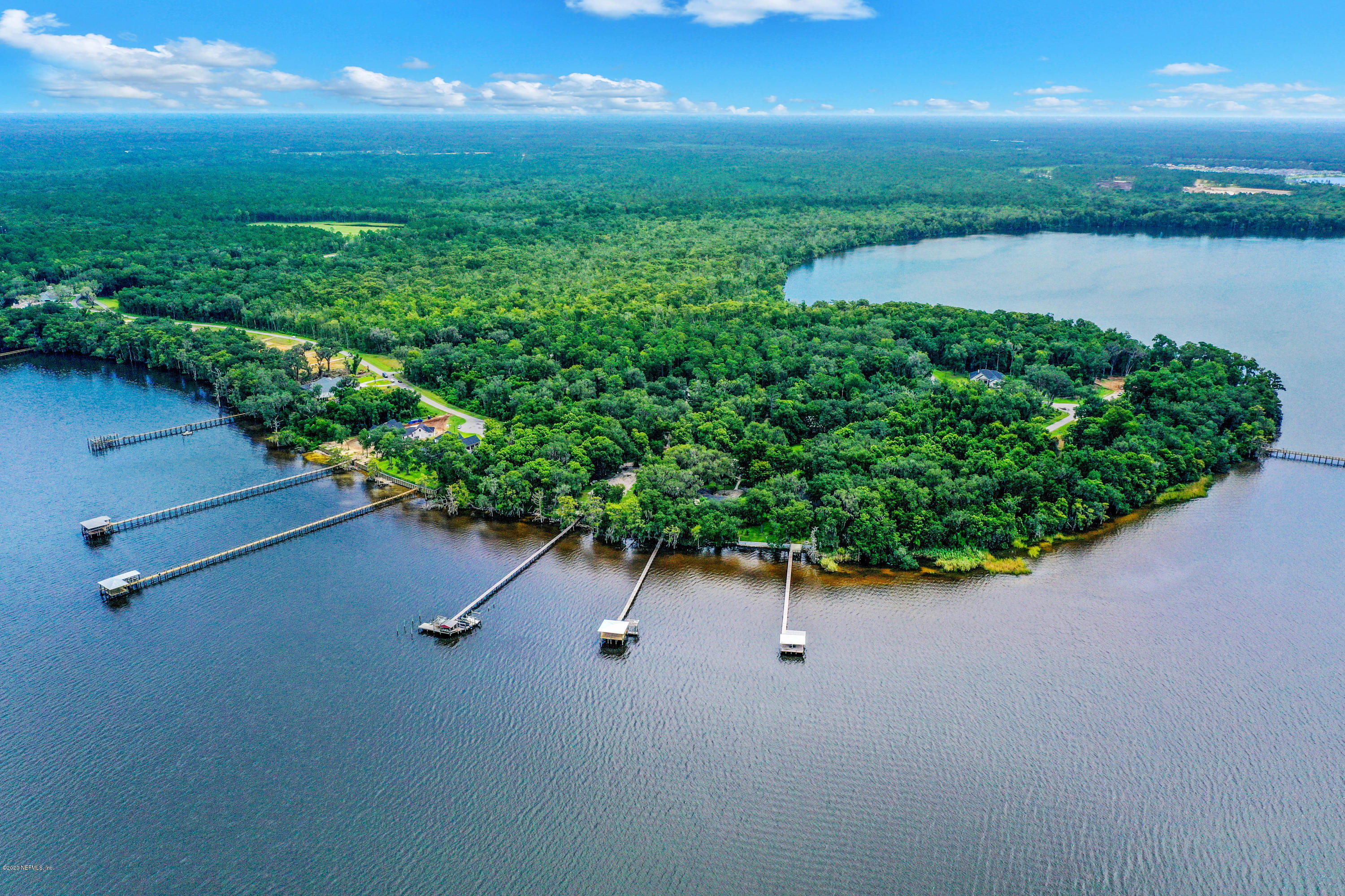 302 Hallowes Cove St. Johns, FL 32259 - Photo 8 of 14 an aerial view of a house with a yard and lake view