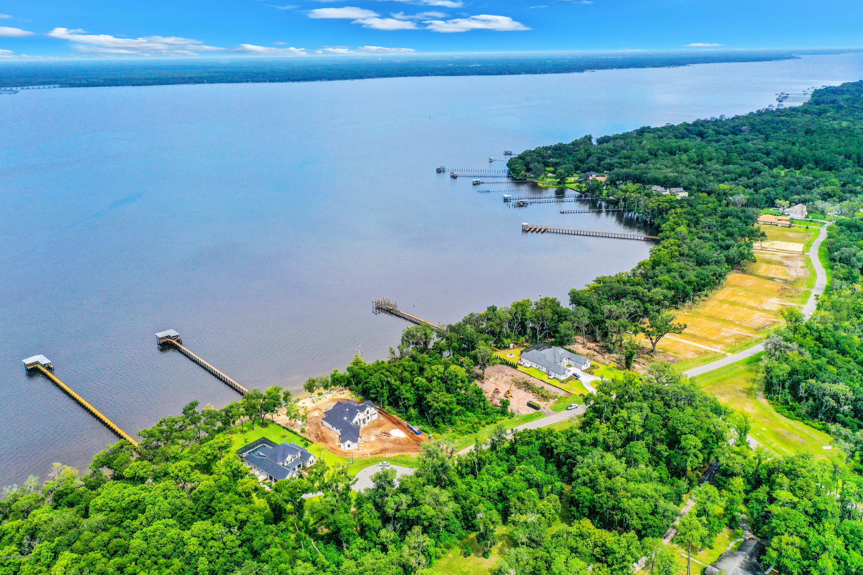 302 Hallowes Cove St. Johns, FL 32259 - Photo 10 of 14 a backyard of a house with lots of green space and lake view