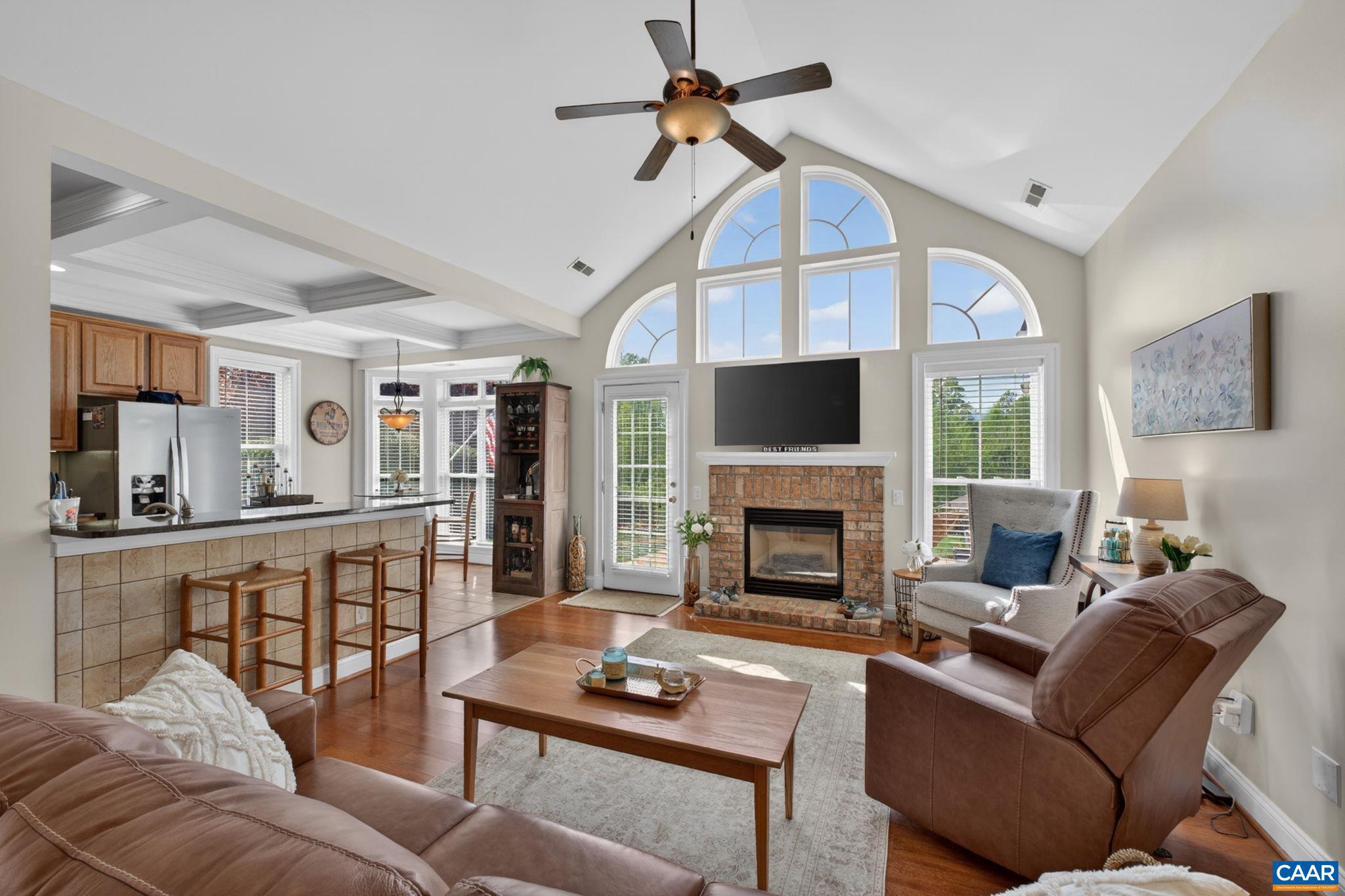 1338 Gate Post Lane Charlottesville, VA 22901 - Photo 11 of 50 a living room with furniture a fireplace and a flat screen tv