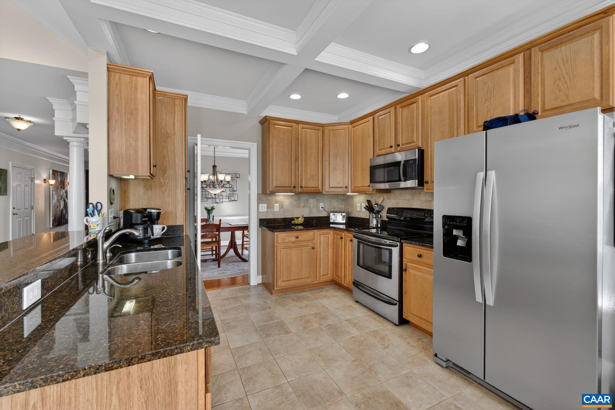 1338 Gate Post Lane Charlottesville, VA 22901 - Photo 13 of 50 a kitchen with stainless steel appliances granite countertop a refrigerator a stove top oven a sink and dishwasher