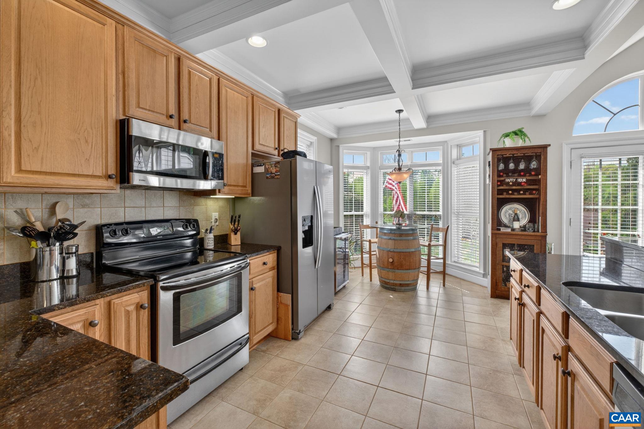 1338 Gate Post Lane Charlottesville, VA 22901 - Photo 14 of 50 a kitchen with stainless steel appliances granite countertop a stove refrigerator and microwave