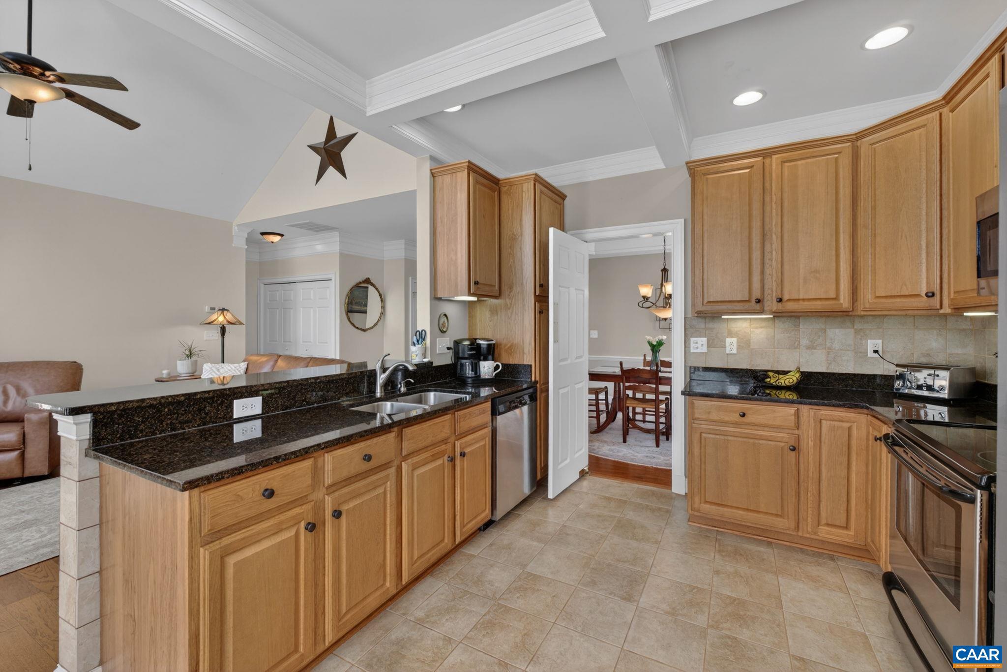 1338 Gate Post Lane Charlottesville, VA 22901 - Photo 16 of 50 a kitchen with stainless steel appliances granite countertop a stove a sink and a refrigerator