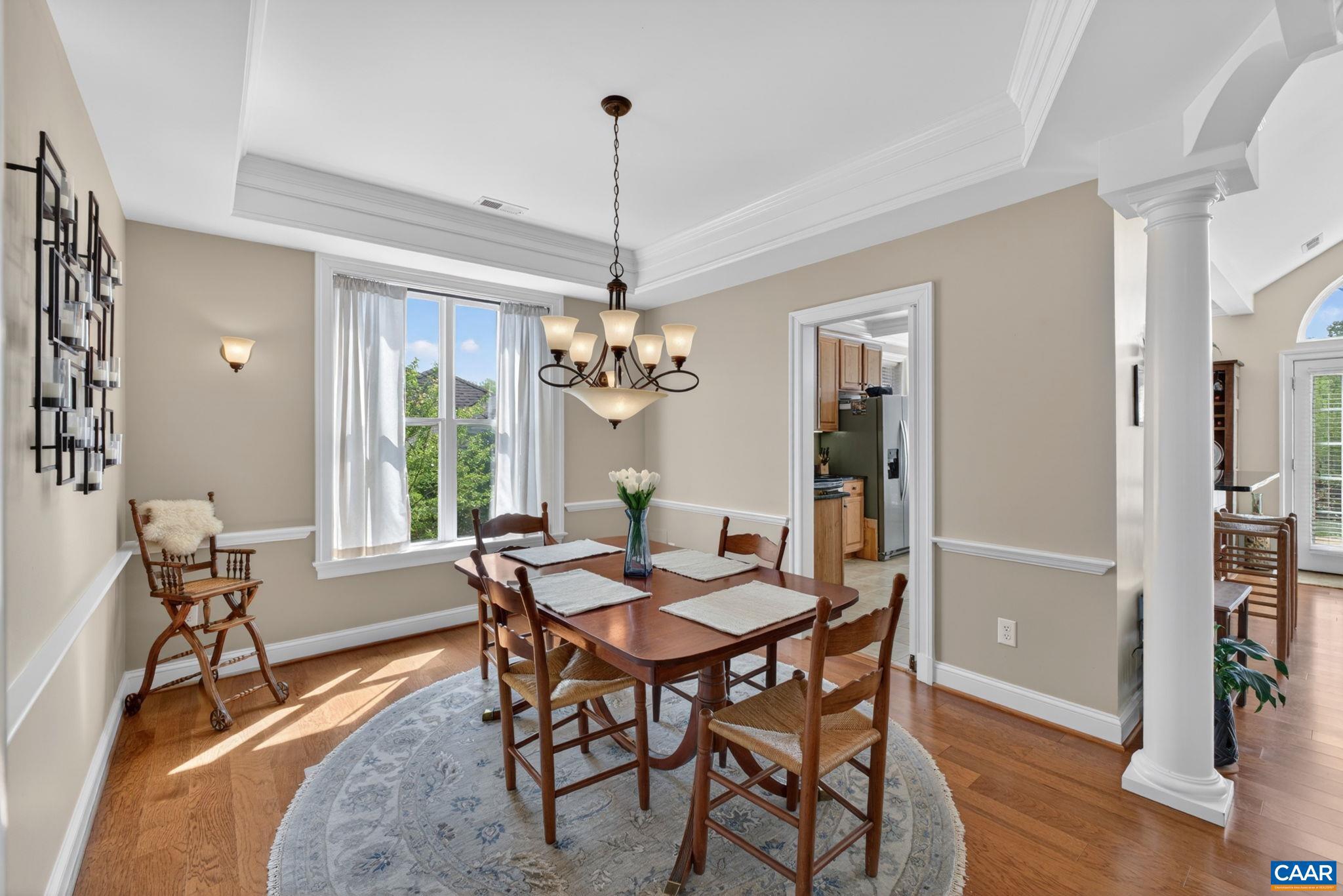 1338 Gate Post Lane Charlottesville, VA 22901 - Photo 22 of 50 a view of a dining room with furniture window and wooden floor