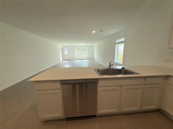 a kitchen with a sink and cabinets