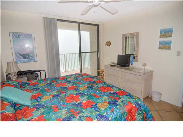 3768 Hwy Santa Rosa Beach, Unit 501 30A Santa Rosa Beach, FL 32459 - Photo 12 of 20 a very nice looking bedroom with a bed and a flat screen tv