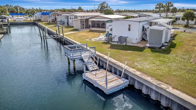an aerial view of a house with swimming pool outdoor seating