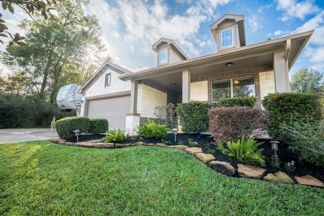 front view of a house with a yard