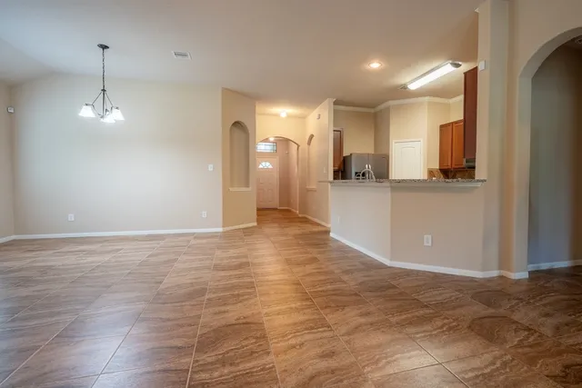 a view of a kitchen with a sink and cabinets