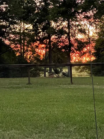 a view of a lake with a big yard