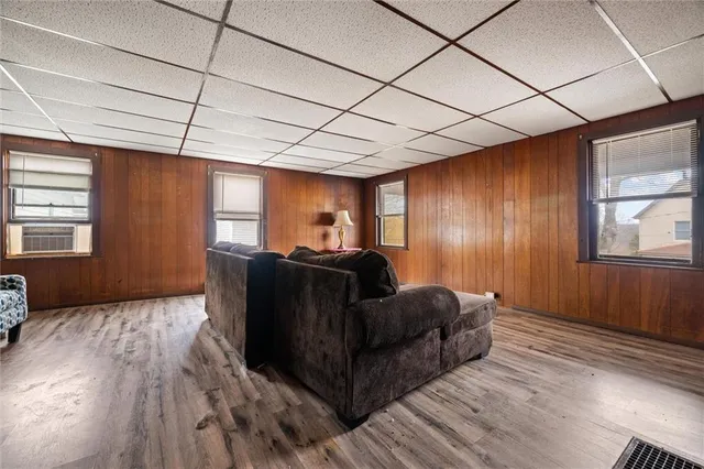 a living room with furniture and a window