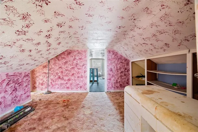 a spacious bathroom with a bathtub and shower