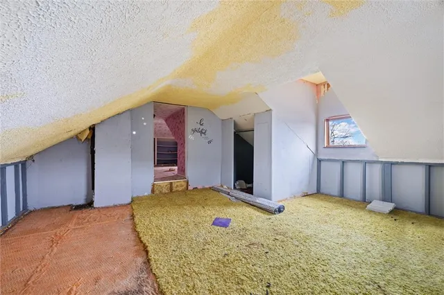 a bedroom with a bed and a cabinets