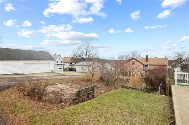 a view of a backyard of the house