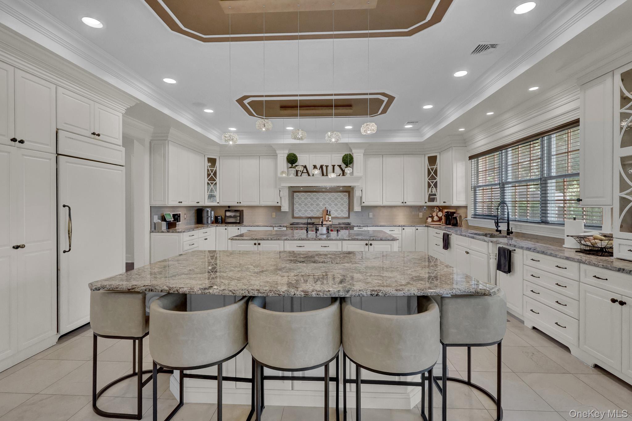 36 Old Field Road Setauket, NY 11733 - Photo 22 of 42 a kitchen with stainless steel appliances granite countertop a table and chairs