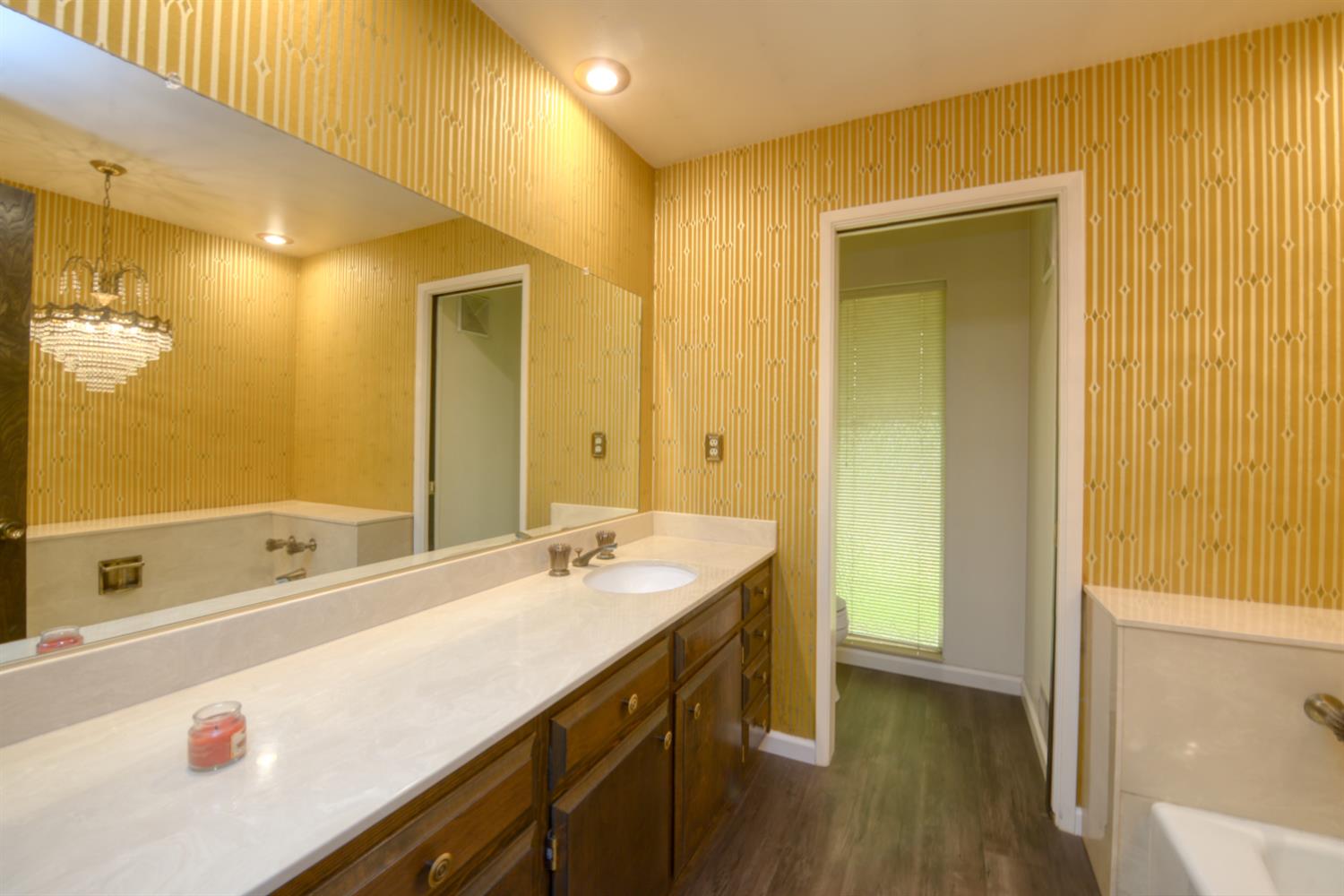 1471 Highway 33 Gustine, CA 95322 - Photo 21 of 57 a bathroom with a tub sink and mirror