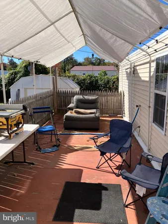 a outdoor space with patio lots of furniture and umbrella