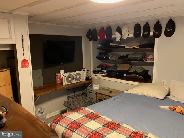 a living room with lots of furniture and a flat screen tv