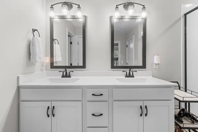 a view of walk in closet with clothes