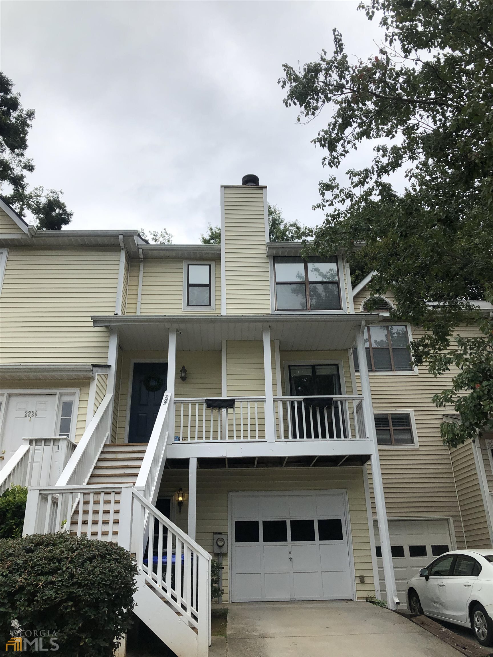 2222 Spring Walk Court Atlanta, GA 30341 - Photo 1 of 1 a front view of a house with parking