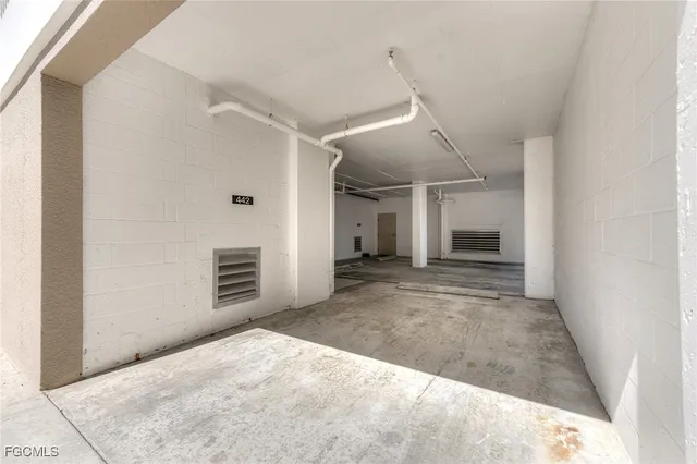 a view of a livingroom with furniture and a floor to ceiling window