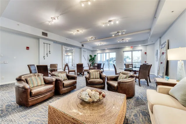view of a tennis ground with large trees