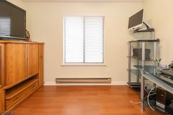 a view of a room with gym equipment and a window