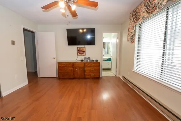 a room with furniture and flat screen tv