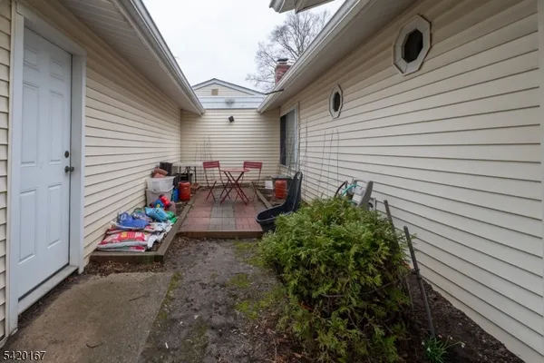 a backyard of a house with seating space
