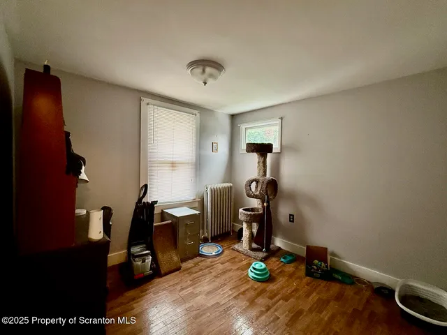 a room with furniture and wooden floor