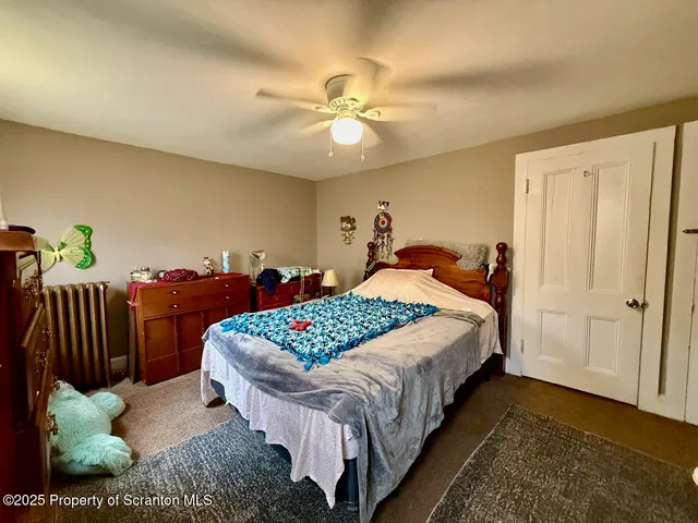 a bed room with a bed and a chandelier