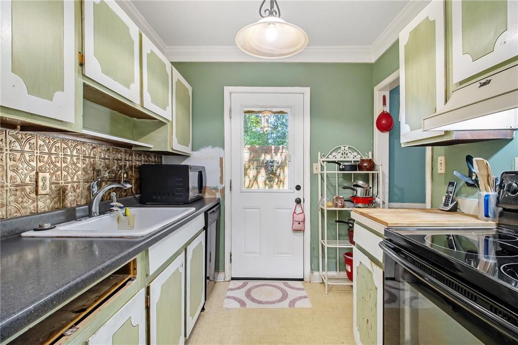 2367 Henderson Mill Road, Unit 8 Atlanta, GA 30345 - Photo 12 of 35 a kitchen with stainless steel appliances granite countertop a sink and a stove