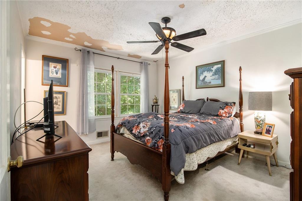 2367 Henderson Mill Road, Unit 8 Atlanta, GA 30345 - Photo 14 of 35 a bedroom with a bed and large windows