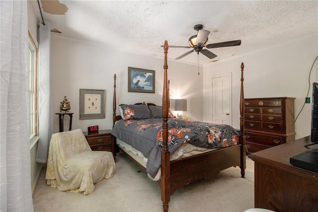 2367 Henderson Mill Road, Unit 8 Atlanta, GA 30345 - Photo 17 of 35 a bed room with a bed and a couch